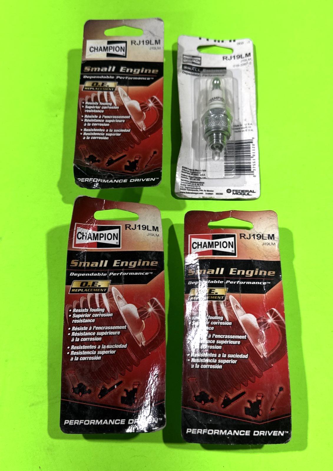 4 PACK OF NEW GENUINE OEM CHAMPION RJ19LM SPARK PLUG; SET OF FOUR PLUGS0