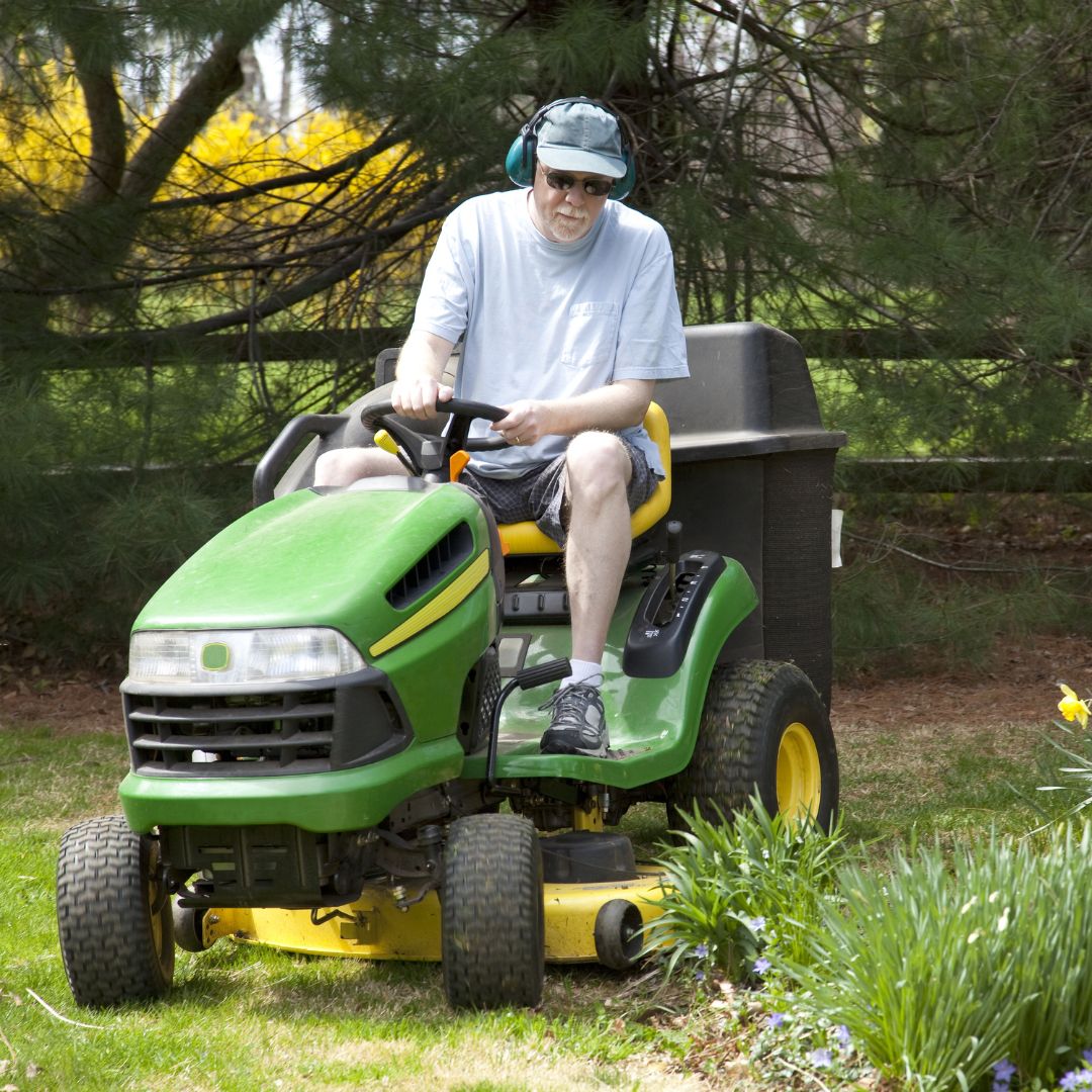 person mowing lawn