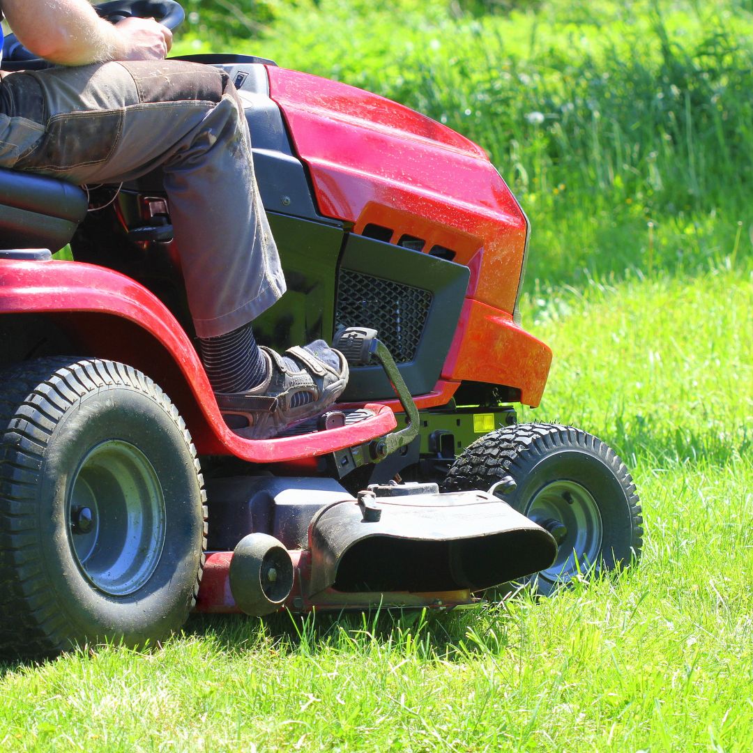 person mowing lawn